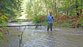 Joe Bartlett measuring a stream