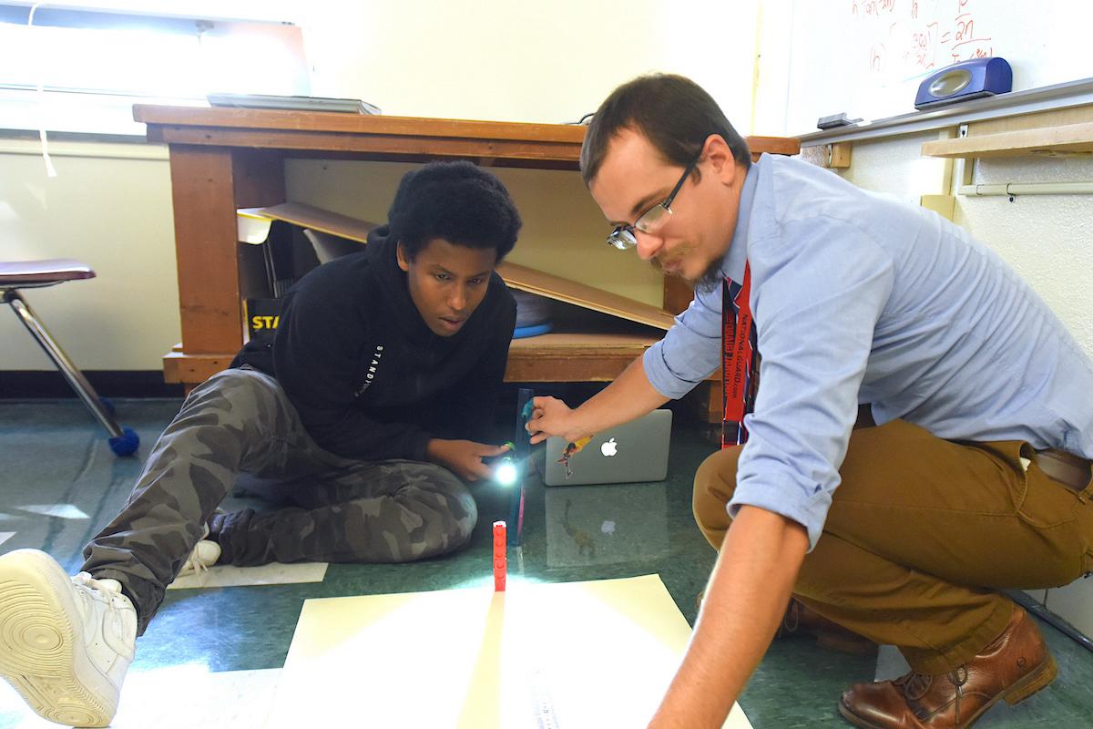 Tom Payer teaching a student at Winooski High School.