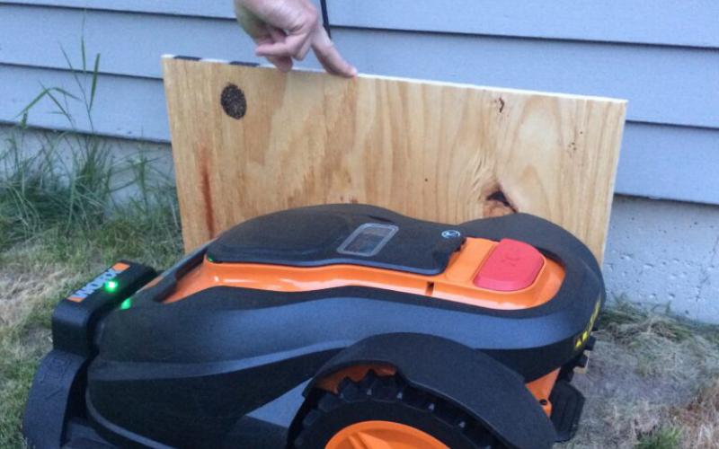 Board showing height of house for Mo, the robotic mower