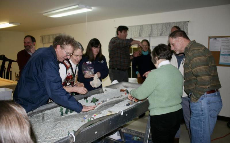 Franklin County municipal officials explore how rivers behave and respond to human impact. Franklin County municipal officials explore how rivers behave and respond to human impact using a flume table – a river modeling tool.