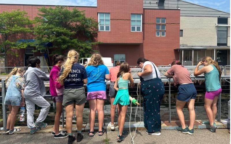Rachel demonstrating how to use a Plankton Tow with the campers Rachel demonstrating how to use a Plankton Tow with the campers