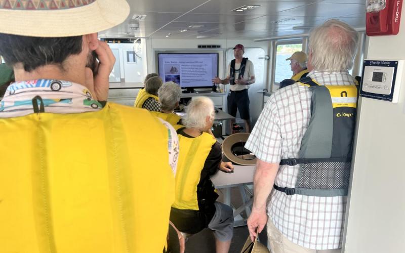 Jeff Hindes - assisting researchers and R/V Marcelle Melosira crew members to deploy equipment off the stern of the boat using the A-frame. Jeff Hindes (current history teacher at a local high school) is lending a hand aboard a Public Summer Trip Series – Stories of Lake Champlain trip by sharing a segment on military history.