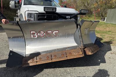 Photo of a segmented plow on a road