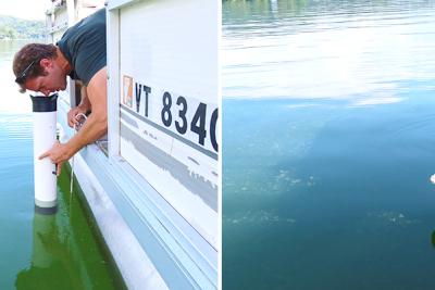 Mark Mitchell leans over side of boat and uses view tube and Secchi disk to measure water clarity on Lake Morey.