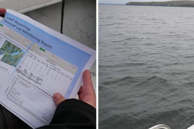 Mark Mitchell pulls rope over side of boat on lake and a paper showing annual lake monitoring report and graph