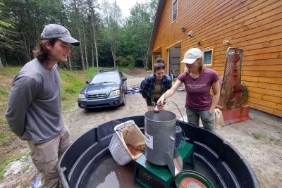 Rob Fitch, Rhona Thomson, and Jess Colby operating the Dybvig, courtesy of Jess Colby, NorthWoods Stewardship Center.