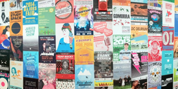 a wall of posters designed by students