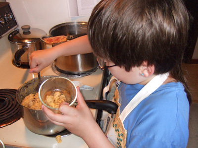NatureBoy spoons mac and cheese into bowls