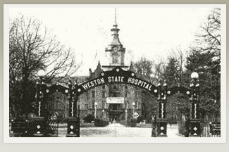 Black and White photograph of the front gate of Weston State Hospital