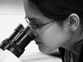 Materials Science student Ishviene Cour examining samples she has prepared under the microscope