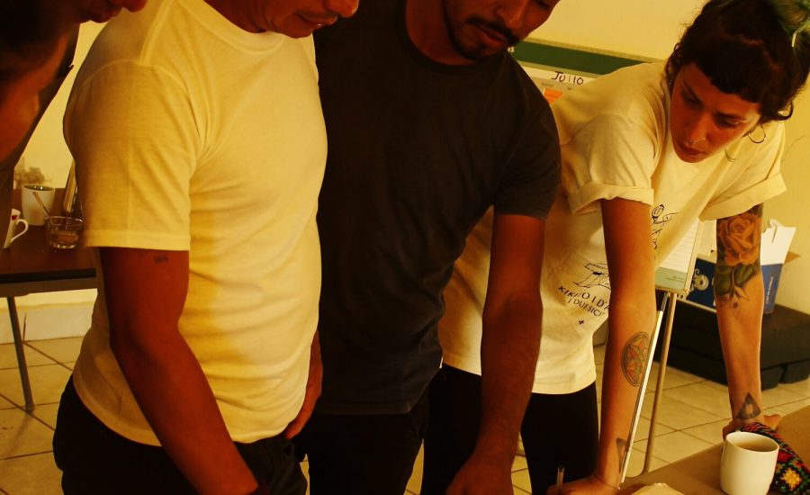 "Graphic designer working with community facilitators and their coordinator on development of popular educational materials, Jaltenango, Chiapas, Mexico (2018). Photo: Alejandra Guzmán Luna