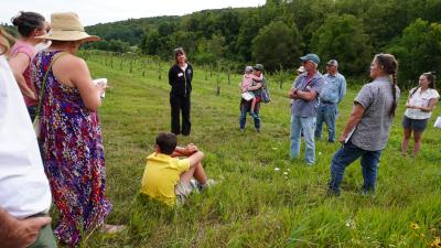 Group of people talking in field