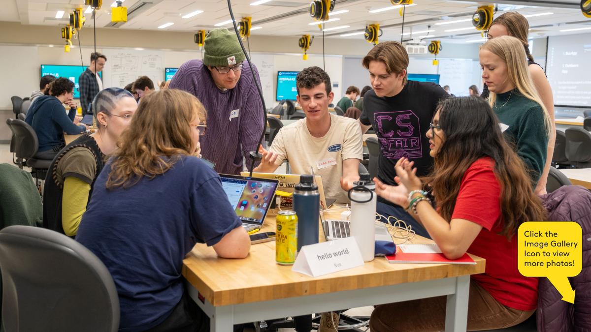 Students collaborate to solve a challenge during the first annual Hackathon