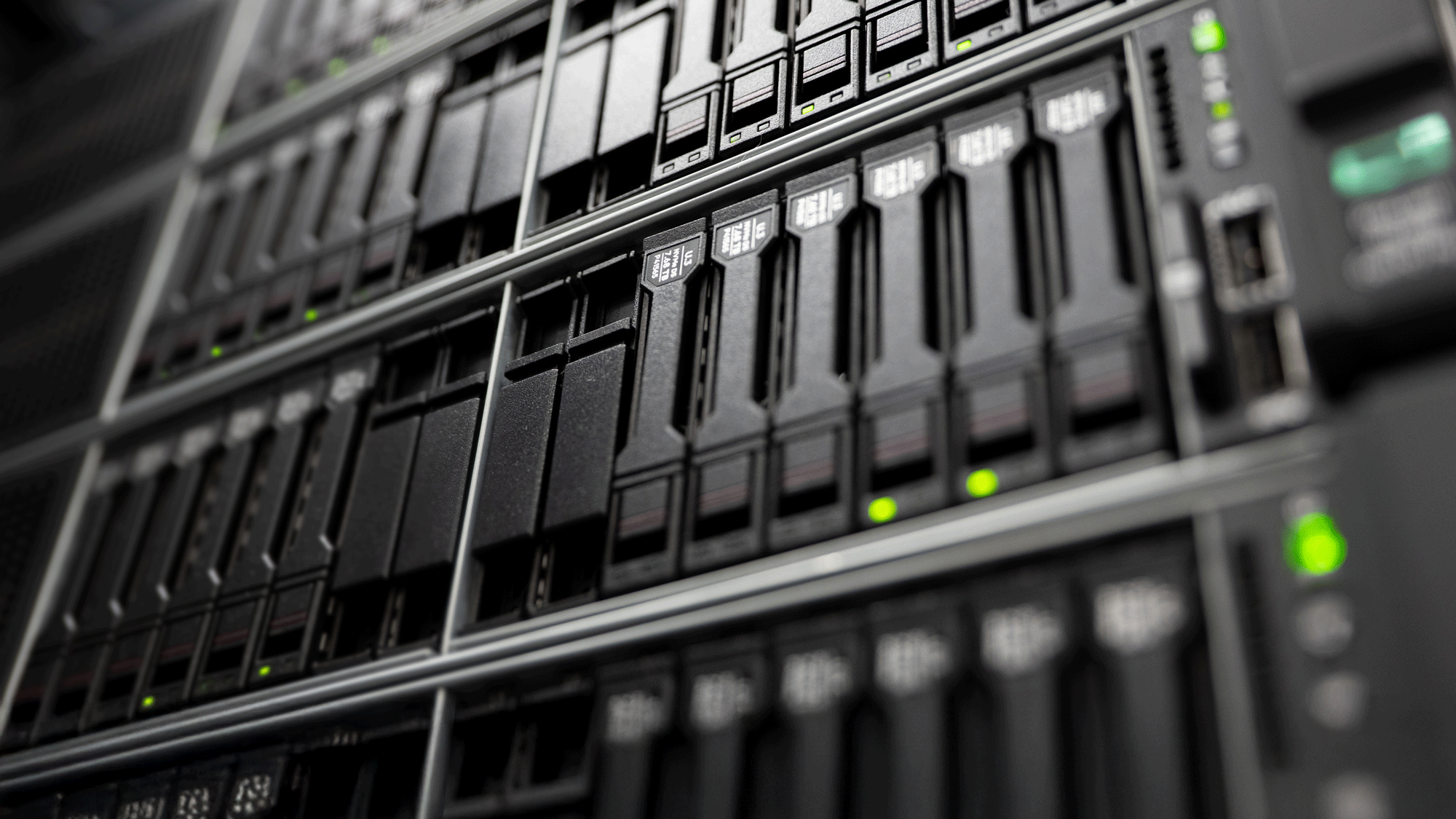 Close-up of computing stack with green lights flashing