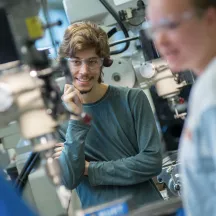 student looks at machinery