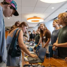 Students interact at a tabling event