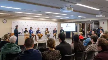 Students on stage giving a presentation