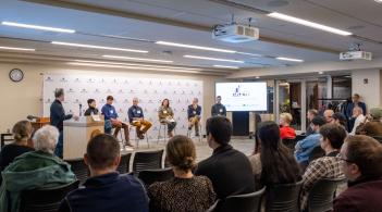 Students on stage giving a presentation