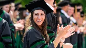 Woman in Graduation Robes Clapping