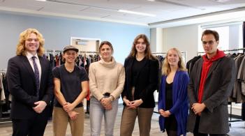 The Grossman Student Advisory Committee (GSAC) poses for a photo at the Professional Business Attire Sale event they host each year.