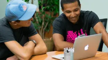Two students studying together at a table