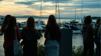 Students enjoying the Burlington waterfront at sunset
