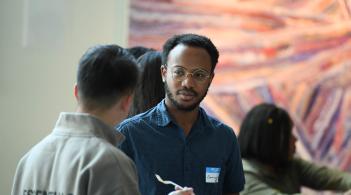 Two students having a discussion at a Speciality sibs meet and greet.
