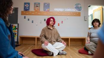 Students meditating in Living Well
