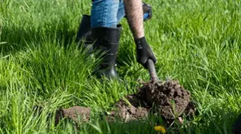 Shovel scooping dirt