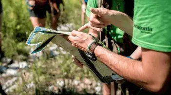 Photo of two people reviewing a map for outdoor programs