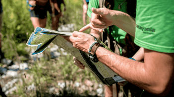 Photo of two people reviewing a map for outdoor programs