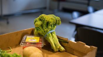 Broccoli with various other produce in box