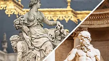Two statues and a building in a city square