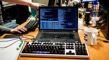 Laptop with code on the screen