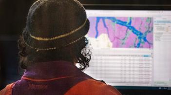 Environmental Engineering student working on hydrological modeling on a computer