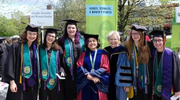 Group of people in graduation robes and caps