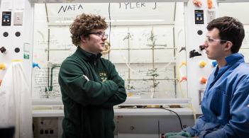 Two students working in a chemistry lab