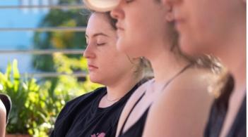 Profiles of people meditating