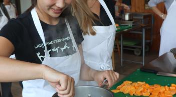 People cooking with fresh vegetables