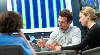 Faculty in the Complex Systems Center meet with a student to discuss research