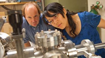 Physics Professor Randall Headrick works alongside a graduate in his lab