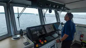 Taylor Resnick captaining the R/V MM.