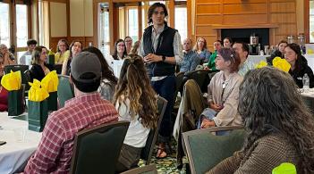 CDAE student speaking to room full of people