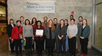 A group of people stand together