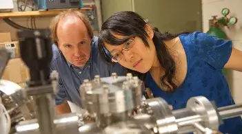 Physics professor Randall Headrick works with a graduate student in his lab
