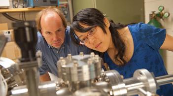 Physics professor Randall Headrick works with a graduate student in his lab