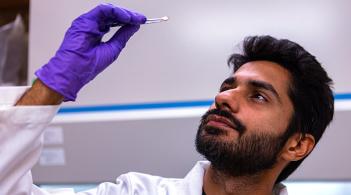 Graduate student working in a CEMS lab