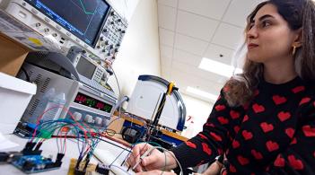 CEMs graduate student at work in an electrical engineering lab