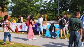 Students standing in front of the club tabling event 