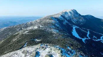 An aerial view of Mount Mansfield with snow on it, by Spatial Analysis Lab